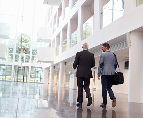 Employer showing new employee around the office during their onboarding process